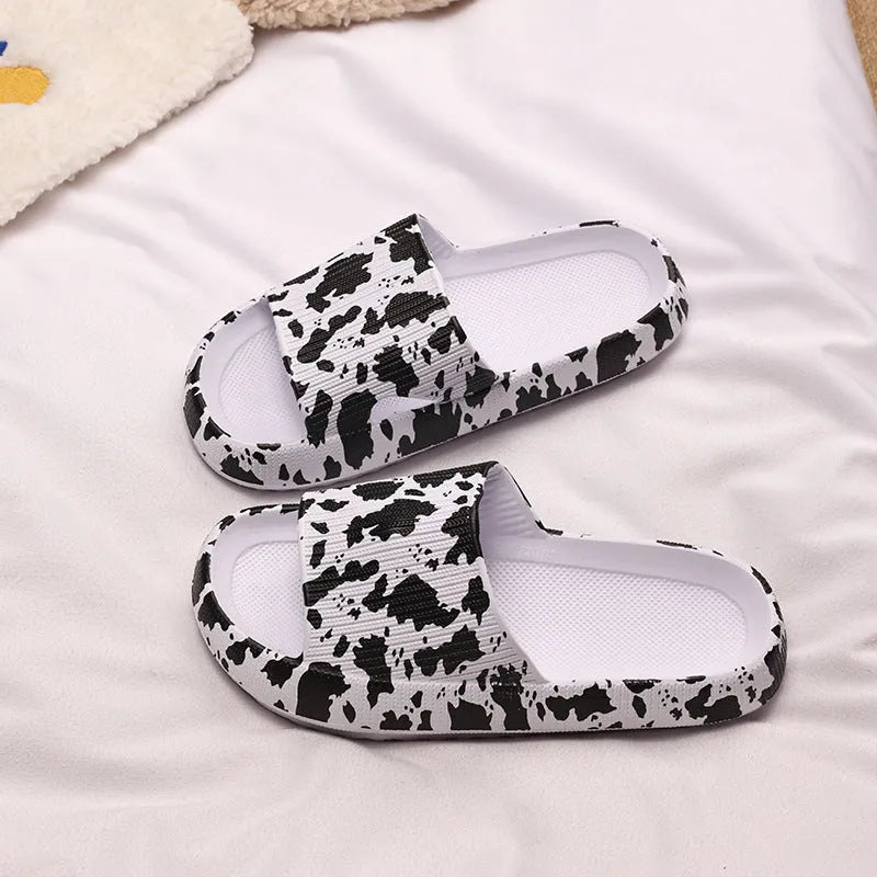Women's leopard print slipper with thick EVA sole shown in multiple colour and print options.