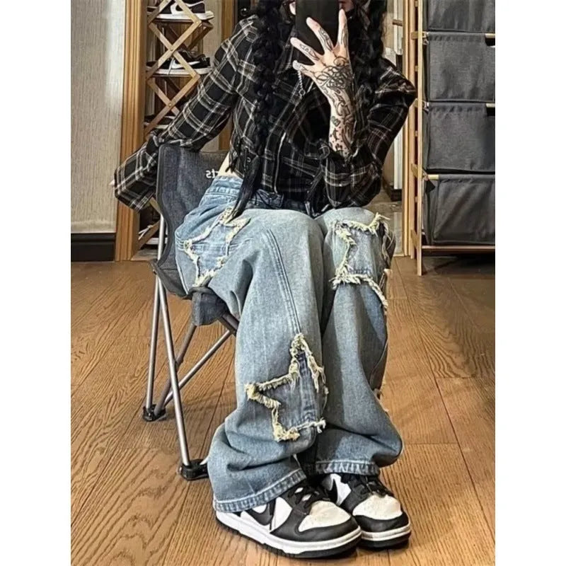 Blue high-waisted wide-leg denim trousers with straight-leg design on hanger
