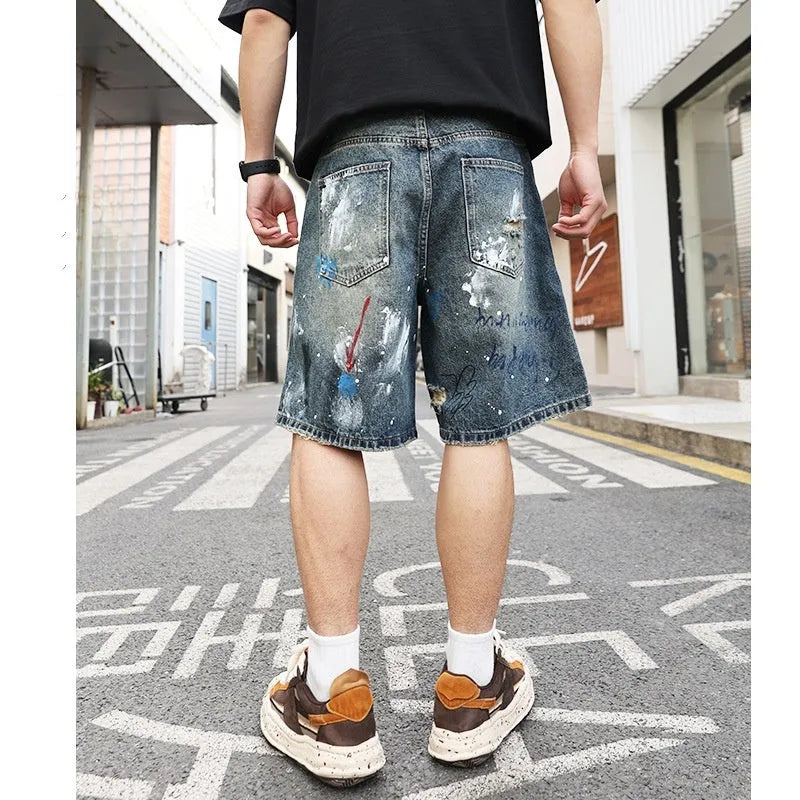 Men's blue distressed denim shorts with straight leg cut and zipper fly