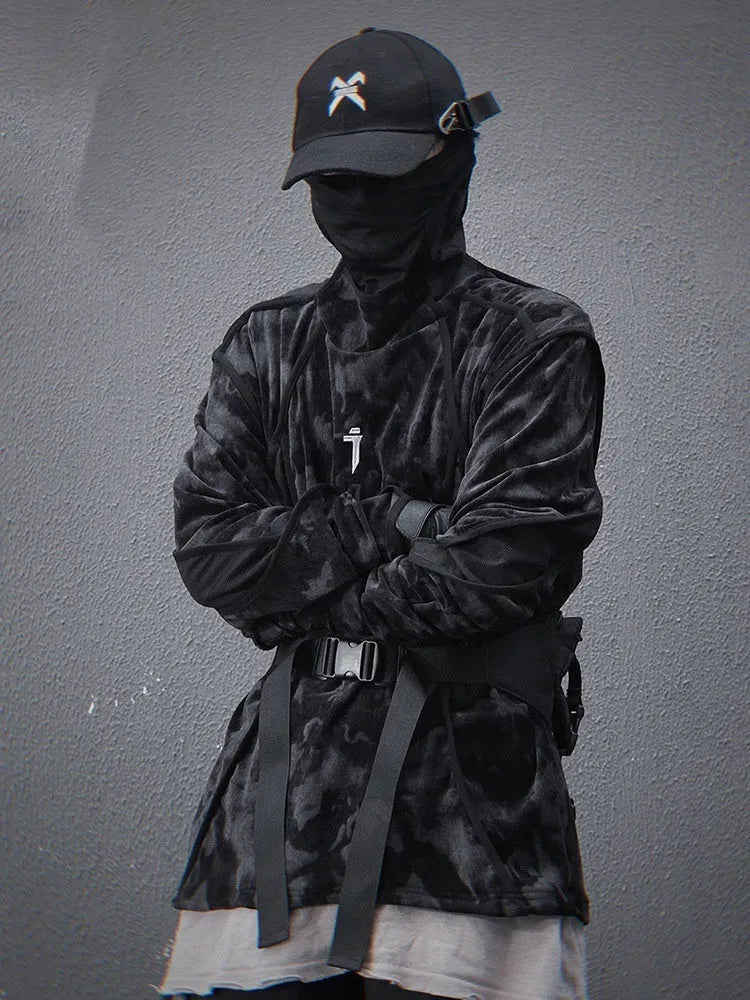 Man modelling a black and grey tie dye finger turtleneck sweater with drop shoulders.