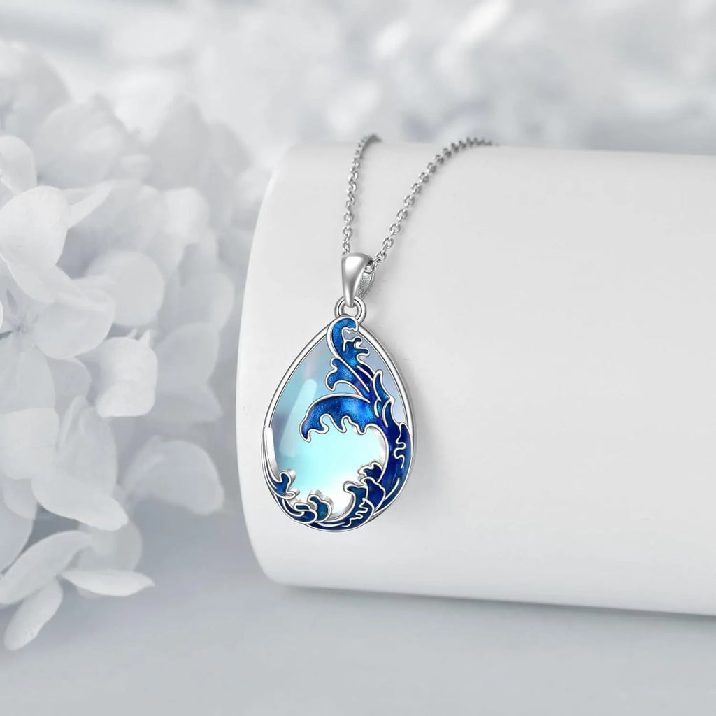 Blue heart-shaped alloy pendant necklace on a silver-tone chain.