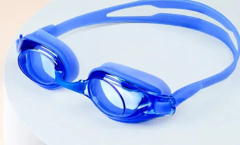 Black swimming goggles with prescription lenses and a matching case, alongside plain blue swimming goggles.