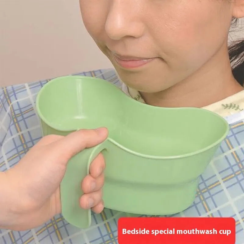 Green plastic gargle cup for elderly bedridden patient nursing care