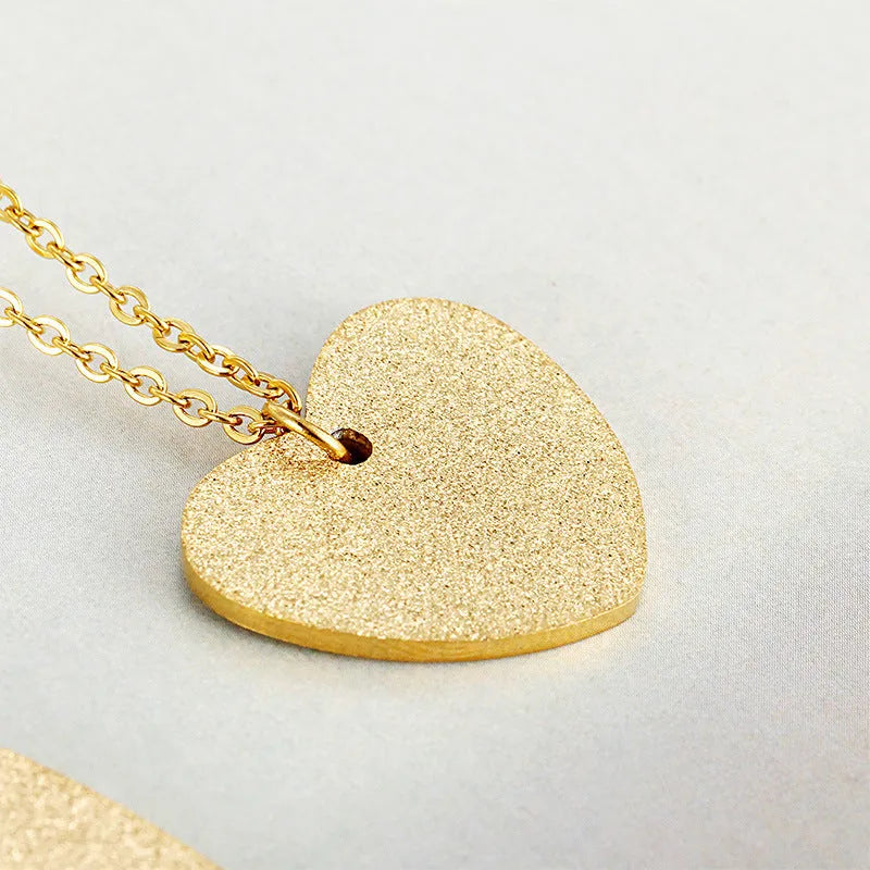 Silver geometric heart pendant necklace on a 45 cm titanium steel chain.