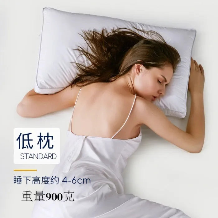 White hotel cotton satin stripe pillow with feather and cotton filling on a bed.