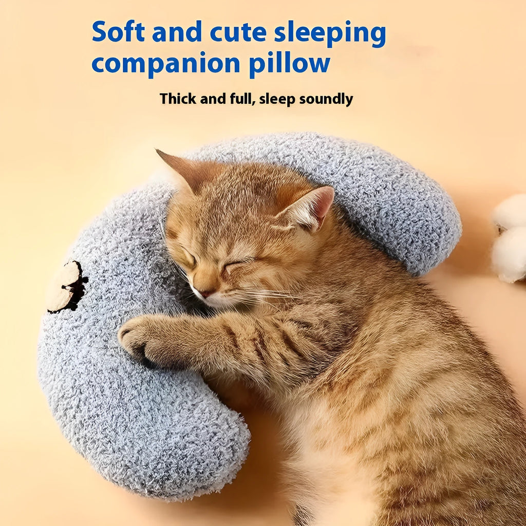 Blue U-shaped cloth pet sleeping mat for cats with neck support pillow in a question mark design.