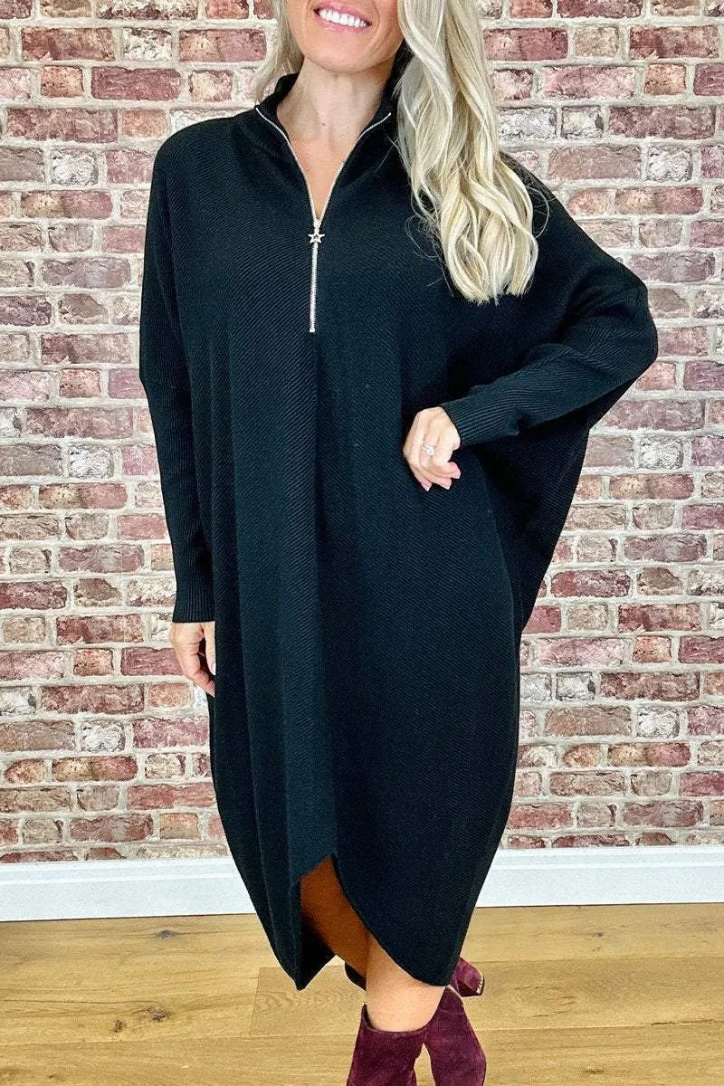 Women's loose-fit knitted dress in navy blue with a front zip closure and raglan sleeves.