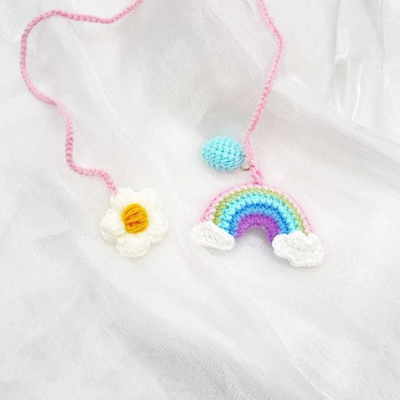 Handmade crocheted car pendant in avocado, pink rainbow, and red rainbow colour designs