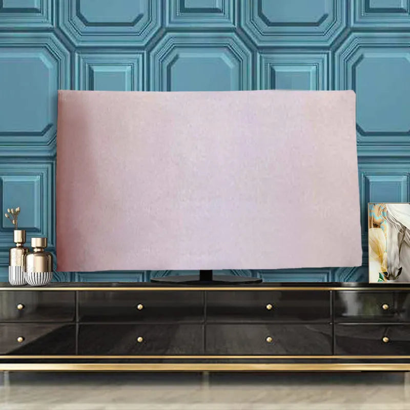 Pink velvet fabric cover draped over a large flat-screen television.