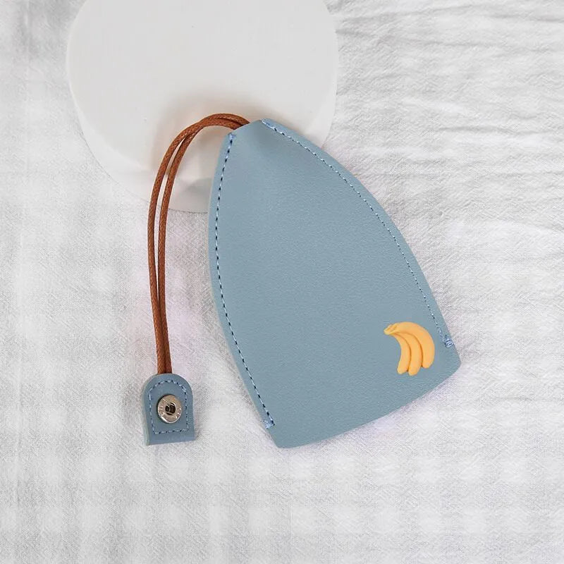 Cartoon pull-out key case in PU leather with colourful design, showing compact 14cm by 7.5cm dimensions
