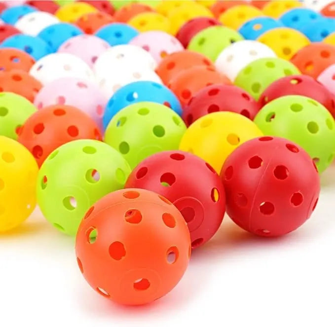 Six multi-colour 42mm golf practice balls in red, orange, blue, green, white, and yellow in a net.