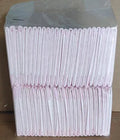Large 60x60cm disposable pet urine pad for dog house training on a floor