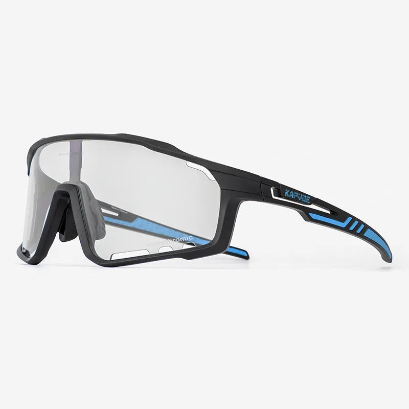 Photochromic cycling sunglasses with a semi-rimless TR90 frame on a solid colour background.