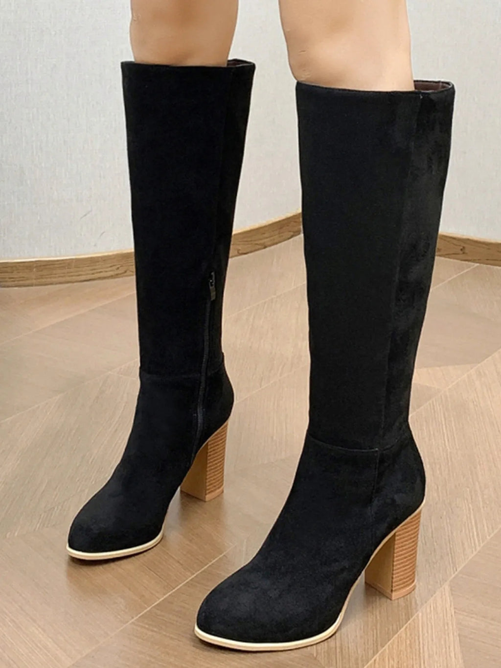 Women's black square toe high heel fashion boots made from synthetic PU material.