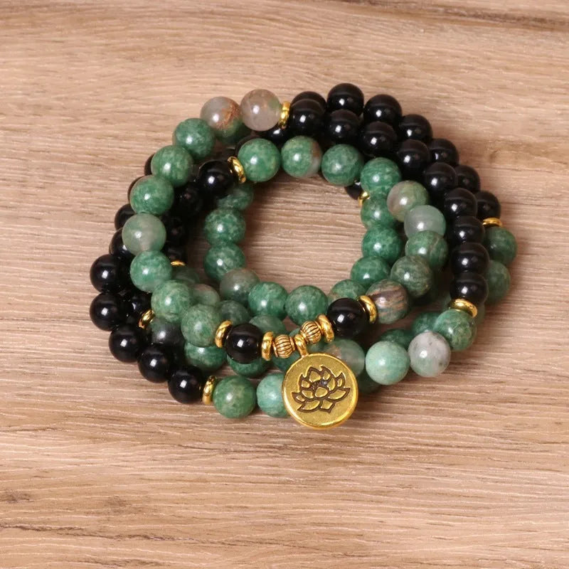 Green and black alloy beaded elastic bracelet with stretch band on wrist