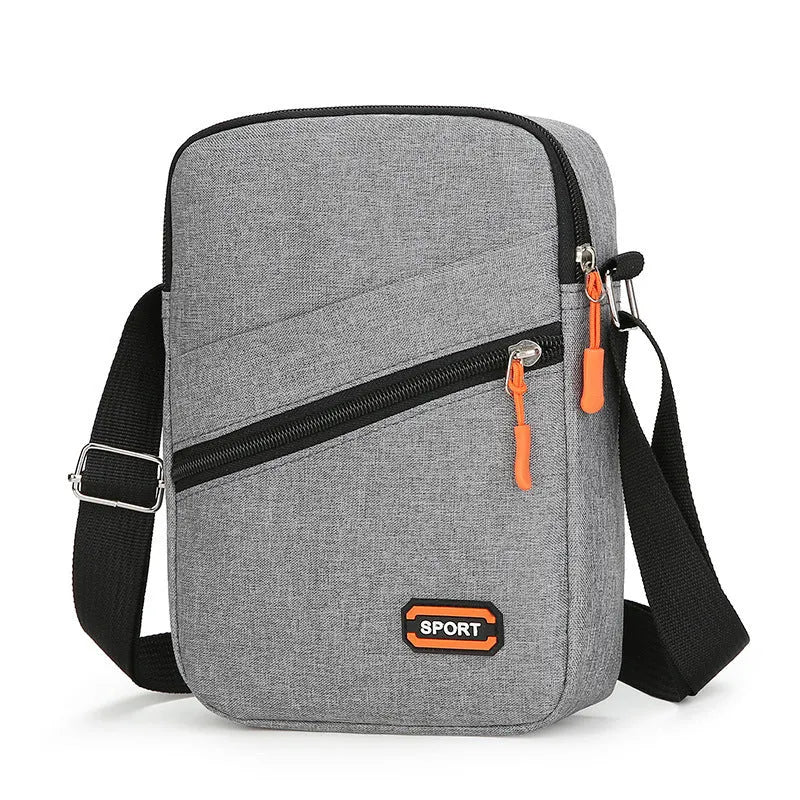 Simple solid-colour Oxford cloth crossbody commuter bag in silver grey, black, or navy blue.
