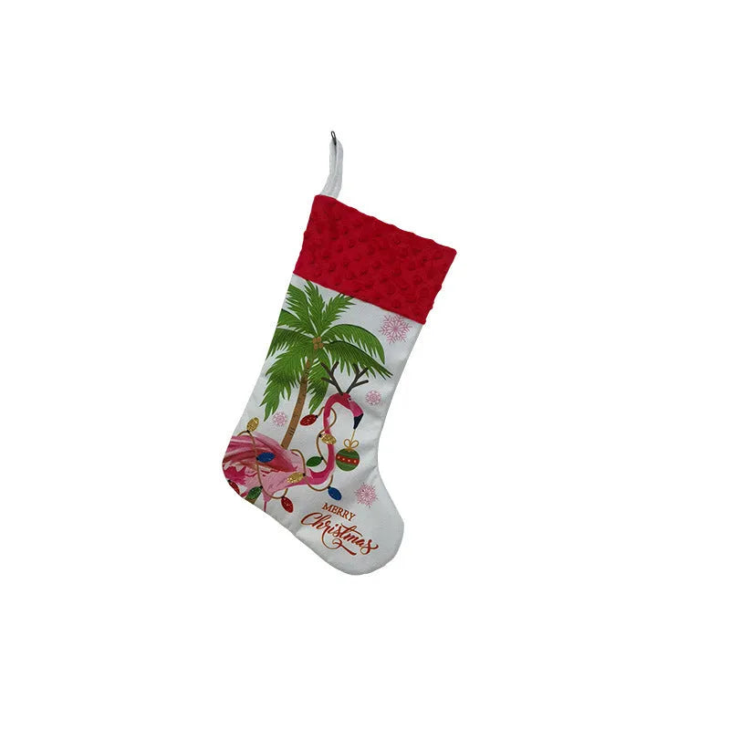 Red and white flamingo print cloth Christmas stocking hanging decoratively.