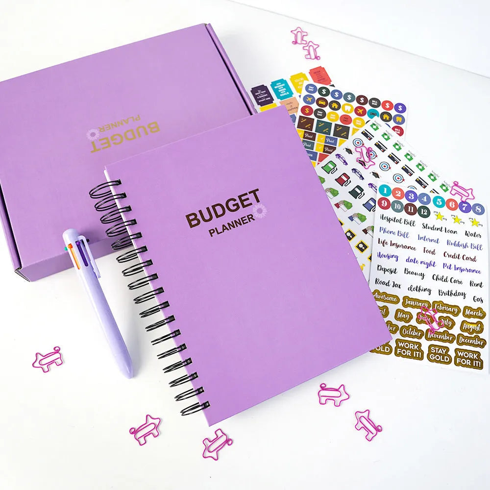 J12 purple coil-bound financial planning notebook with pen and sticker accessories for monthly budgeting