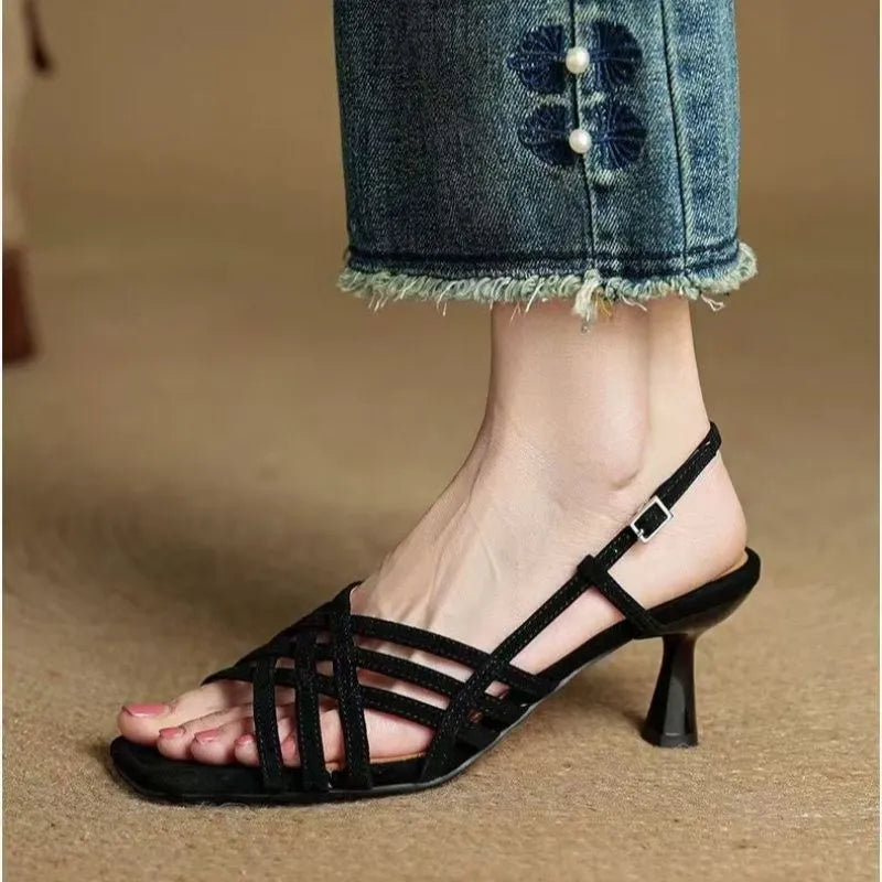 Retro style women's sandals with thin cross straps, ankle buckle, square toe, and a mid-height heel.