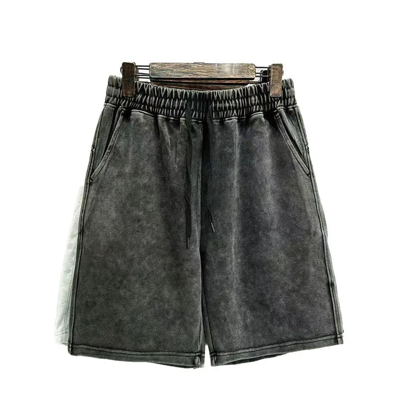 Men's loose-fit cotton casual shorts in distressed style, shown in charcoal black.