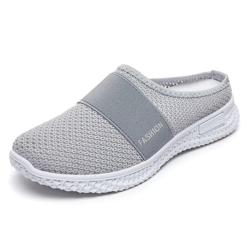 Women's breathable mesh casual shoes with flat heel, round toe, and hollow-out design in black, grey, pink, or purple.