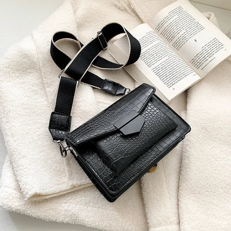 Vintage-style black PU leather crossbody bag with dimensions 20cm by 14cm by 7cm.