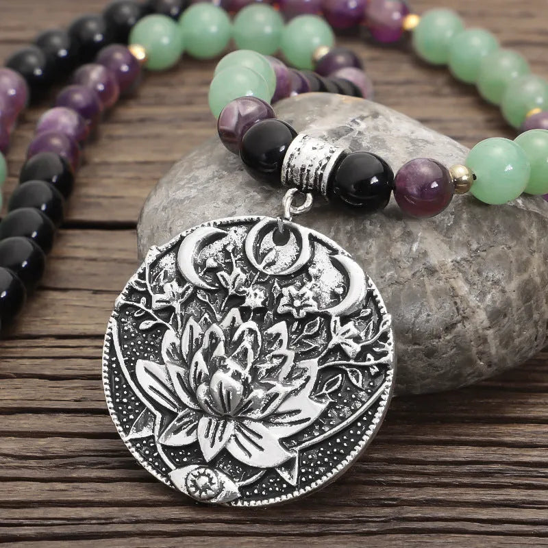 Dongling long yoga lotus pendant necklace and bracelet set with geometric alloy pendant and stone beads.