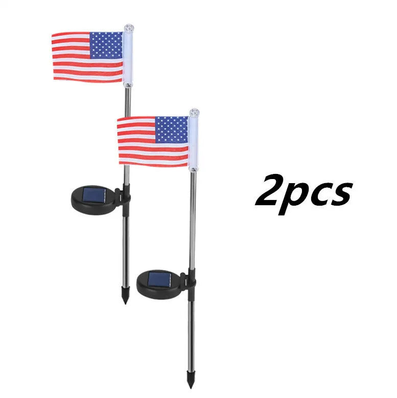 Solar garden flag light with stainless steel pole showing either American or British flag design.