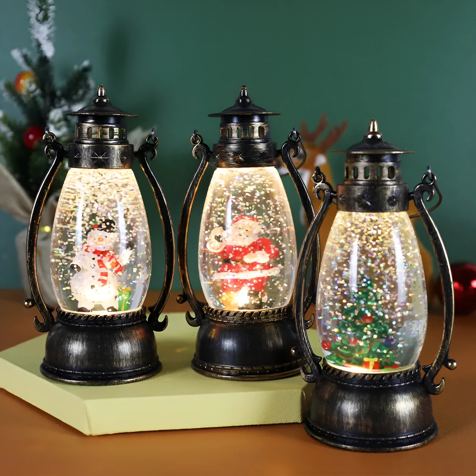 Crystal ball LED Christmas ornament showing snowman and elderly oil lamp design variations
