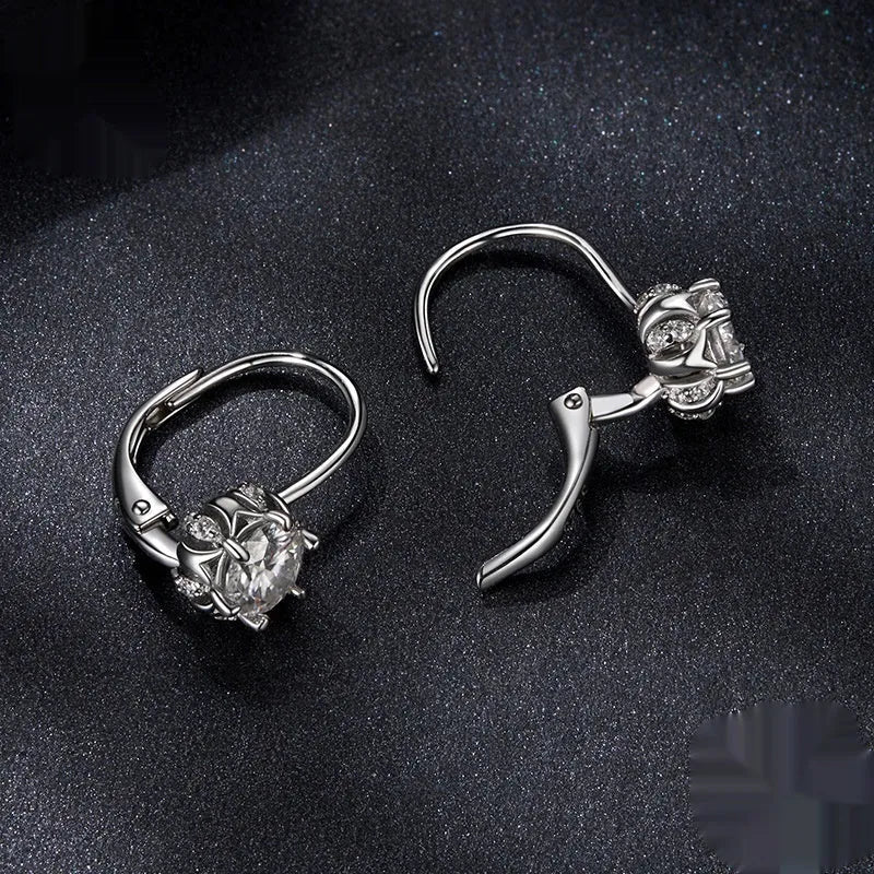 Sterling silver flower bud clip earrings with moissanite stones and white gold plating