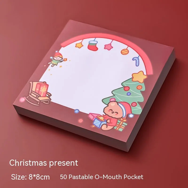 Christmas sticky notes book showing cartoon designs of Elf, Gift, Sled, Ball, Santa, House, Bear, and Snowman