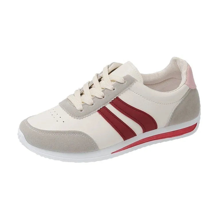 Blue low top lace-up sneaker with soft rubber sole and PU mesh upper
