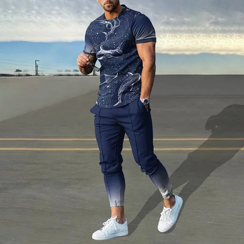 Man wearing a printed short-sleeve t-shirt and matching trousers from a cotton-like men's tracksuit set.