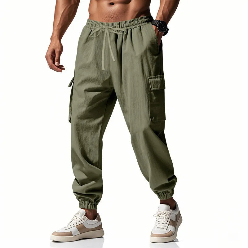 Men's loose-fit linen trousers with ankle-tied cuffs and multiple pockets.