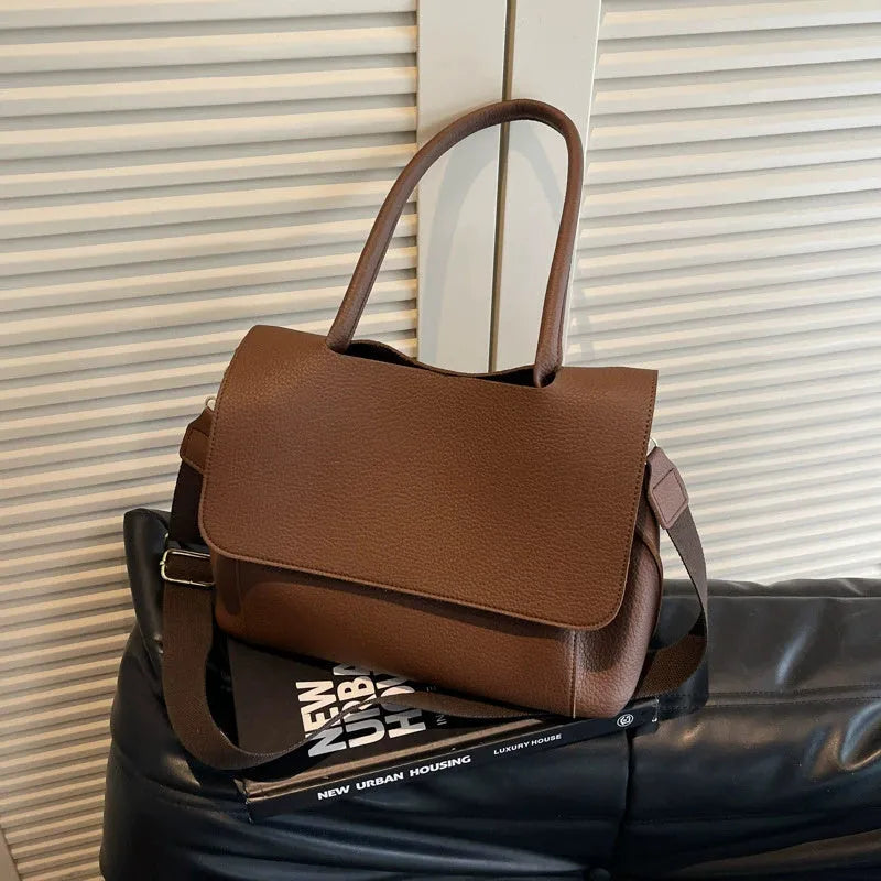 Square synthetic leather tote bag with double straps in a neutral colour.