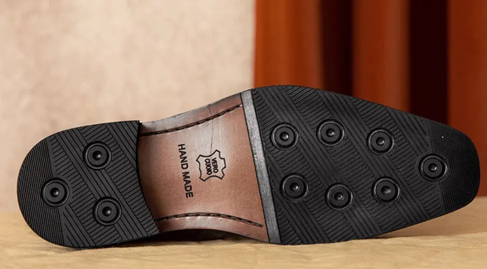 Men's black genuine leather slip-on loafers with a polished finish and rubber sole