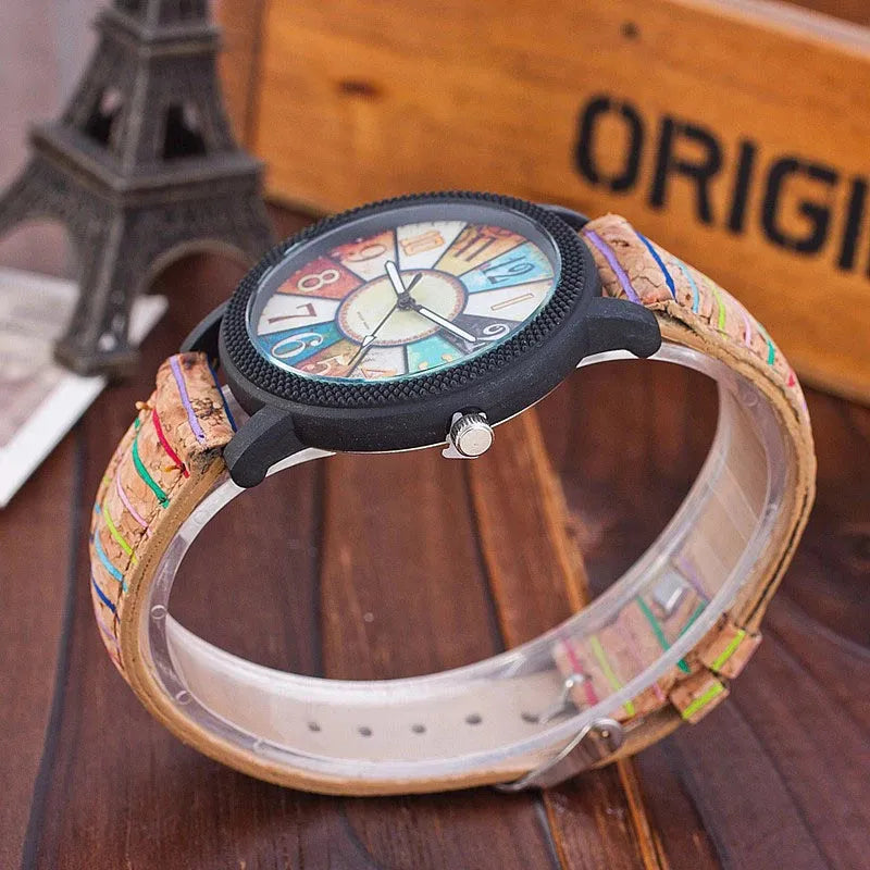 Vintage style women's leather strap quartz watch with round 37mm dial and stainless steel buckle.