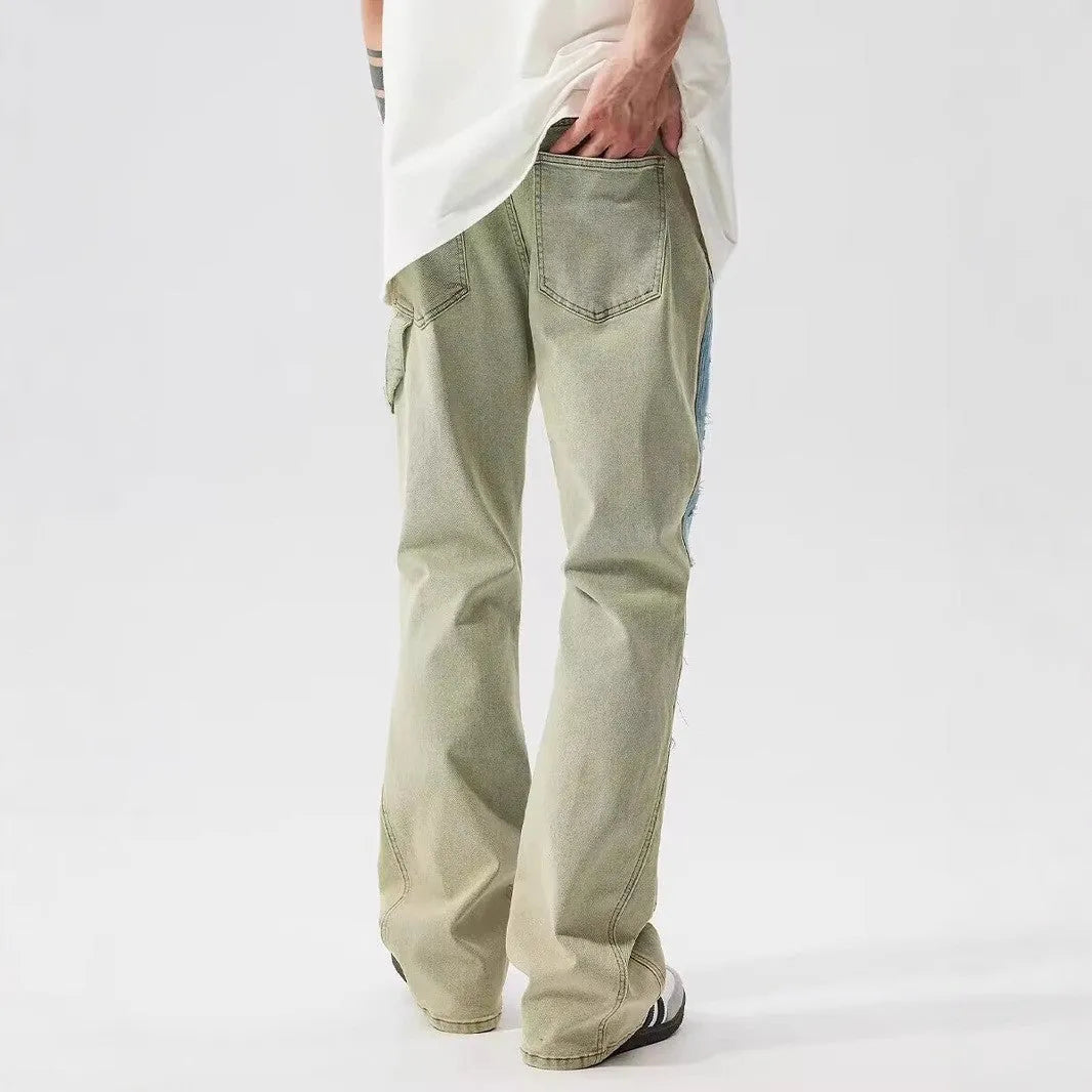 Retro yellow and blue patchwork jeans with splash-ink damaged design showing front and back views