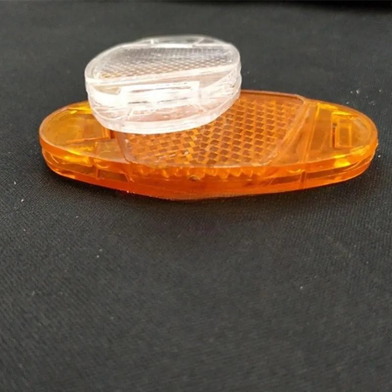 Bicycle plastic spoke reflector measuring 7.2cm by 3.5cm in white or yellow colour for front and rear wheel safety