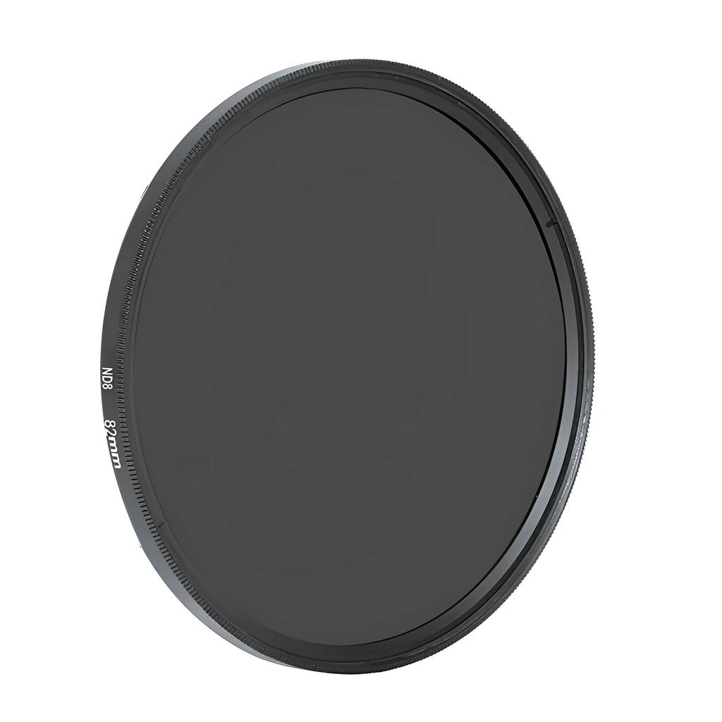 ND8 neutral density camera filter reducer with aviation aluminium frame shown next to lens.