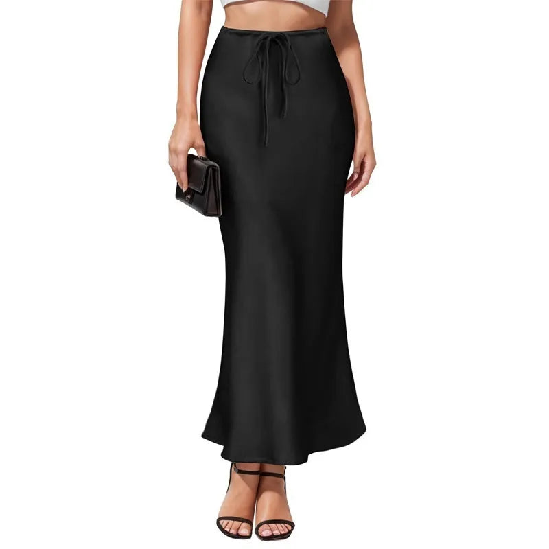 Women's high-waist asymmetric acetate skirt in black showing irregular hem detail