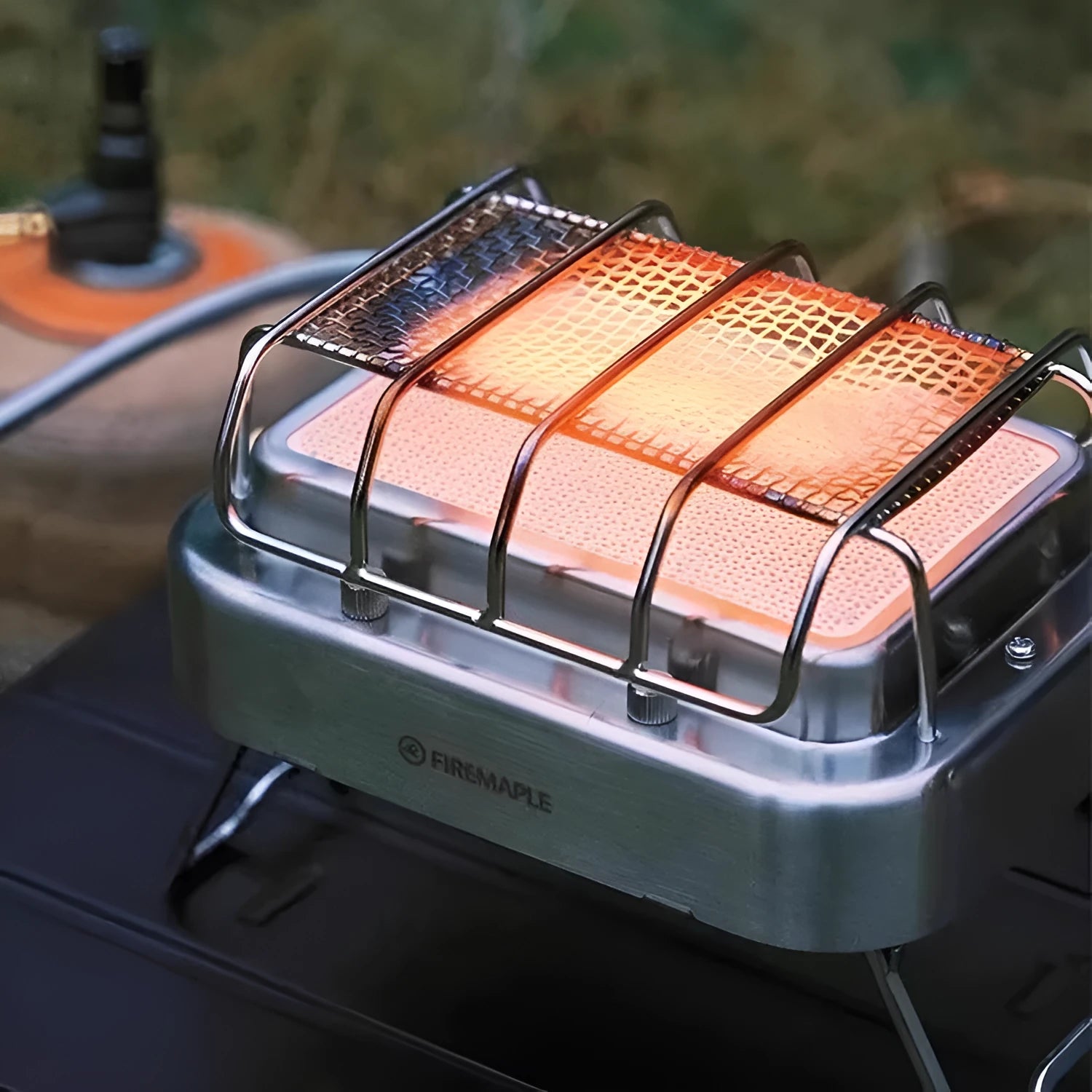 Outdoor heating stove showing expanded 180x167x125mm metal construction with voltage regulator