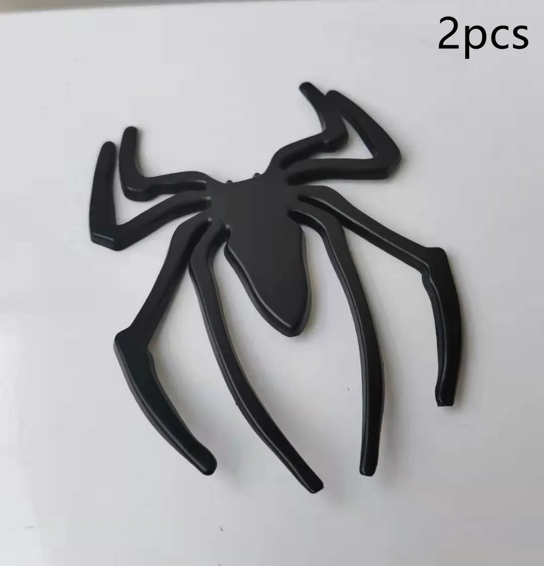 3D metallic spider bumper sticker in gold, silver, black, and red colour options.