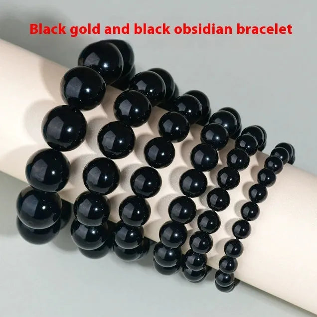 Hand-woven round obsidian bead bracelet in multiple colour options on a wrist.