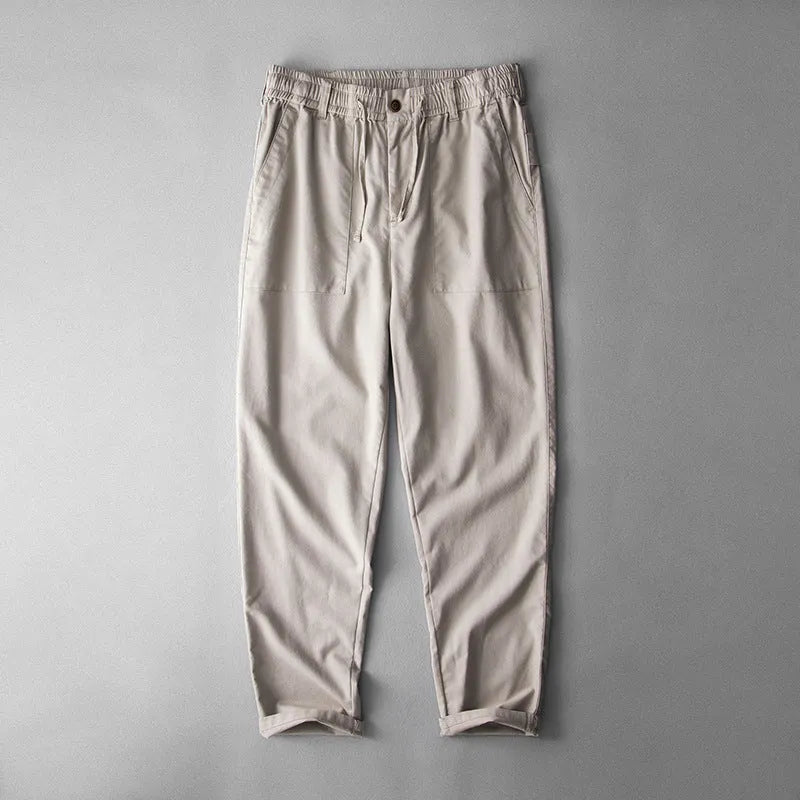 Men's casual linen trousers in solid colour with mid waist design available in navy blue, apricot linen, or grey