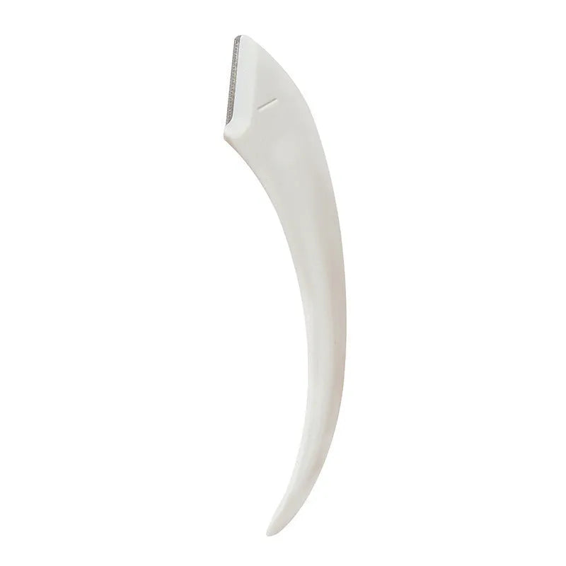 Curved moon-shaped eyebrow trimmer with a cutting comb on a white background.