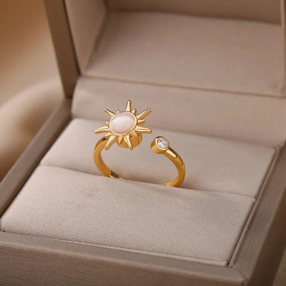 Rotatable decompression ring with adjustable opening in gold electroplated finish