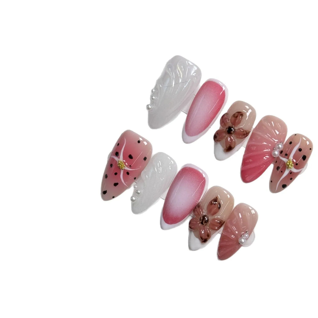 Hand-painted three-dimensional carved nail art patches in embossed candy colours, showing almond shape.