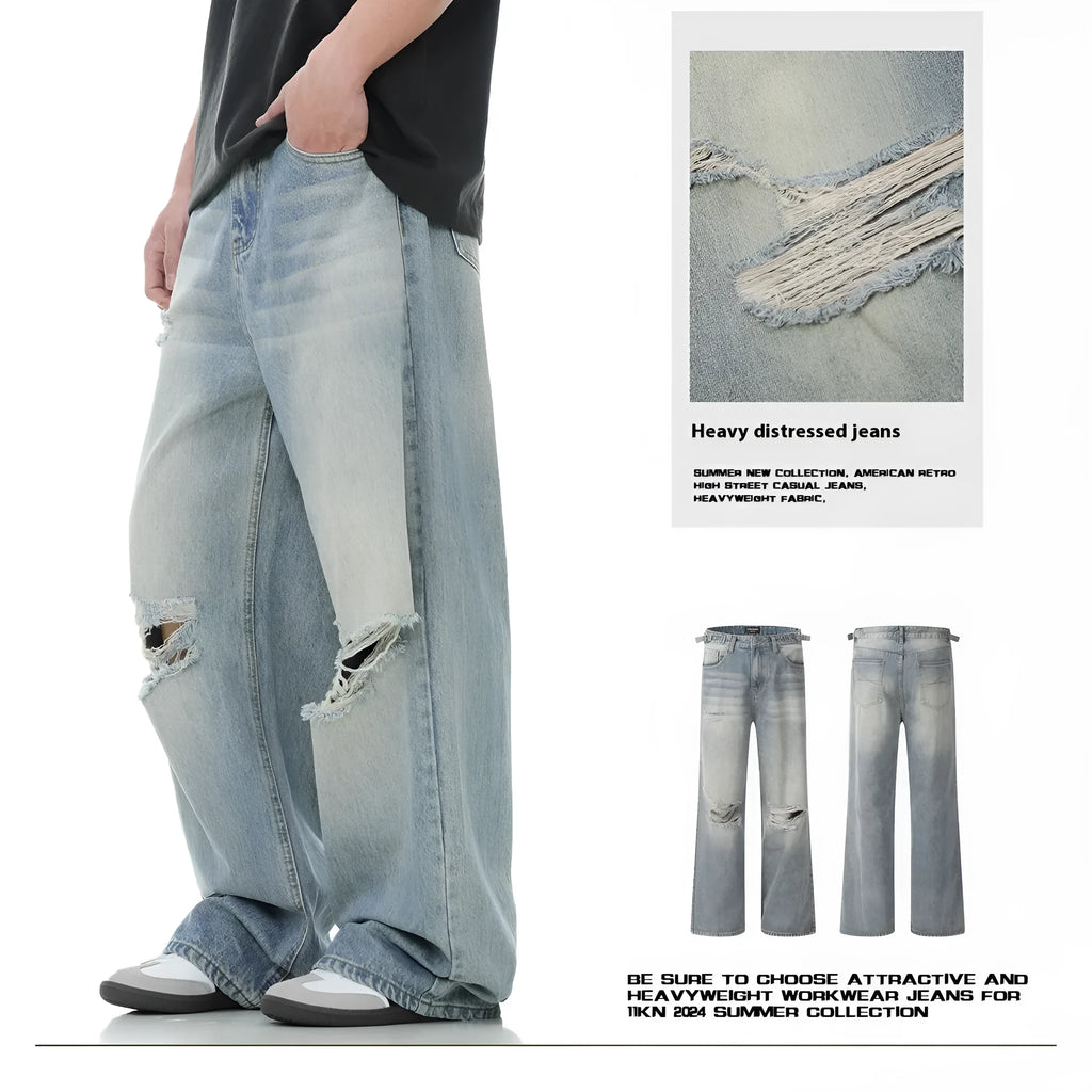 Blue men's straight-leg jeans with ripped detailing on the legs, showing a zipper fly.