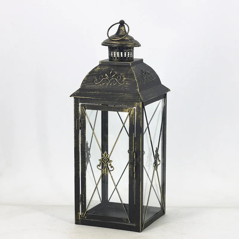European-style wrought iron floor-standing storm lantern with tempered glass panels in black gold brush finish